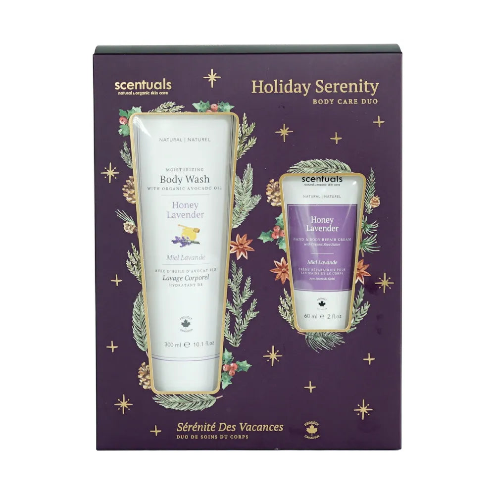 A gift set package for Scentuals Holiday Serenity Body Care Duo, containing Honey Lavender Body Wash and Hand Repair Cream, with floral decorations and a purple background.
